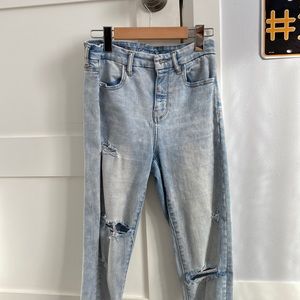 Light Wash Jeans with holes that have fabric underneath